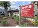 IPP's Pastaria & Bar sign on Canton Street with lush landscaping and an outdoor dining area at 355 Highlands Trce, Roswell, GA 30075