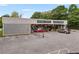 Commercial building with a spacious parking lot, signage and storefronts for antiques and interiors at 355 Highlands Trce, Roswell, GA 30075