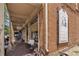 Charming brick storefront featuring Roswell Provisions, with outdoor seating and a rustic, inviting ambiance at 355 Highlands Trce, Roswell, GA 30075