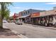 Street view of Lola's Burger and Bar, with vibrant storefronts and outdoor seating at 355 Highlands Trce, Roswell, GA 30075