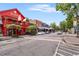 Street view of Mac McGee, featuring colorful storefronts and outdoor seating at 355 Highlands Trce, Roswell, GA 30075