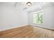 Bright bedroom with decorative trey ceilings and hardwood floors at 576 Cliftwood Ct, Sandy Springs, GA 30328