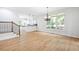 Bright dining area with hardwood floors and large window overlooking a landscaped yard at 576 Cliftwood Ct, Sandy Springs, GA 30328