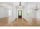 Bright foyer with wood floors and a decorative glass front door, open to living space at 576 Cliftwood Ct, Sandy Springs, GA 30328