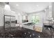 Spacious kitchen features granite counters, stainless steel appliances, and a functional island at 576 Cliftwood Ct, Sandy Springs, GA 30328