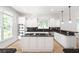Modern kitchen featuring stainless steel appliances, granite countertops, and large windows at 576 Cliftwood Ct, Sandy Springs, GA 30328
