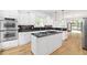 Gourmet kitchen featuring double ovens, a center island, and abundant counter space at 576 Cliftwood Ct, Sandy Springs, GA 30328