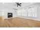 Bright living room with a fireplace, built-in shelves, and beautiful hardwood floors at 576 Cliftwood Ct, Sandy Springs, GA 30328