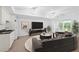 Finished basement with plush seating, a kitchenette, and a large window for ample light at 576 Cliftwood Ct, Sandy Springs, GA 30328
