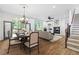 Living room with dining table, fireplace, ceiling fan and view to the deck at 576 Cliftwood Ct, Sandy Springs, GA 30328