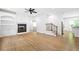 Bright living room with a fireplace, built-in shelves, and hardwood floors at 576 Cliftwood Ct, Sandy Springs, GA 30328