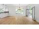 Bright, airy living room with hardwood floors, white trim, and many windows with a view to the deck at 576 Cliftwood Ct, Sandy Springs, GA 30328