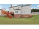 Grassy backyard features a deck and stairs, great for outdoor living and enjoying the serene surroundings at 112 Tara Blvd, Loganville, GA 30052