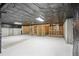 Unfinished basement with concrete walls, ceiling, and wood framing ready for personalization at 112 Tara Blvd, Loganville, GA 30052