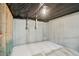 Unfinished basement with concrete walls, ceiling with visible plumbing and wood framing at 112 Tara Blvd, Loganville, GA 30052