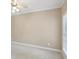 Neutral bedroom with light carpeting, ceiling fan, and bright window at 112 Tara Blvd, Loganville, GA 30052