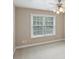 Carpeted bedroom featuring bright windows and a contemporary ceiling fan at 112 Tara Blvd, Loganville, GA 30052