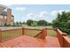 Exterior deck overlooking a large yard and beautiful house with a brick chimney at 112 Tara Blvd, Loganville, GA 30052