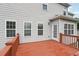 Exterior view of a gray home with a door and deck with view to the yard at 112 Tara Blvd, Loganville, GA 30052