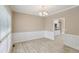 Dining room includes wainscotting, neutral paint and hardwood floors at 112 Tara Blvd, Loganville, GA 30052