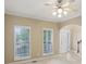 The entryway of the home features large windows for natural light at 112 Tara Blvd, Loganville, GA 30052