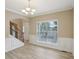 Entryway features staircase, wainscotting, and large window for natural light at 112 Tara Blvd, Loganville, GA 30052