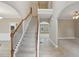 Open entryway with staircase and views into the living and dining areas at 112 Tara Blvd, Loganville, GA 30052