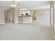 Open living area featuring views into the kitchen, archways, and great lighting at 112 Tara Blvd, Loganville, GA 30052