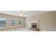 Cozy living room with a brick fireplace and ample natural light from large windows at 112 Tara Blvd, Loganville, GA 30052