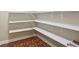 Walk-in pantry featuring multiple white shelves for optimal storage at 112 Tara Blvd, Loganville, GA 30052