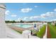 Enjoy the community pool with lounge chairs and umbrellas at 112 Tara Blvd, Loganville, GA 30052
