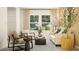 Bright living room featuring cozy seating, natural light, and modern decor at 213 Sunshine St, Acworth, GA 30102