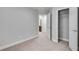 Bedroom with view to bathroom and closet with neutral carpeting and paint at 2325 Limehurst Ne Dr, Atlanta, GA 30319