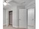 Bright bedroom featuring a ceiling fan, closet, and neutral carpeting at 2325 Limehurst Ne Dr, Atlanta, GA 30319