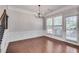 Elegant dining area with hardwood floors, wainscoting, and abundant natural light at 2325 Limehurst Ne Dr, Atlanta, GA 30319