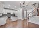 Bright, open kitchen with granite countertops, stainless steel appliances and hardwood floors, plus staircase to 2nd floor at 2325 Limehurst Ne Dr, Atlanta, GA 30319