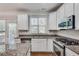 Well-appointed kitchen boasts granite countertops, stainless steel appliances, and bright, sunlit windows at 2325 Limehurst Ne Dr, Atlanta, GA 30319