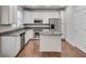 Modern kitchen features granite countertops, stainless steel appliances, hardwood floors, and a convenient center island at 2325 Limehurst Ne Dr, Atlanta, GA 30319