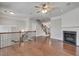 Bright living room featuring fireplace, hardwood floors, and staircase with decorative iron railing at 2325 Limehurst Ne Dr, Atlanta, GA 30319