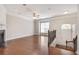 Open-concept living room with hardwood floors, fireplace, and ample natural light at 2325 Limehurst Ne Dr, Atlanta, GA 30319