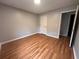 Bedroom featuring wood floors, a closet, and a neutral color palette at 80 Brooks Ln, Dallas, GA 30157