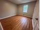 Bedroom featuring wood floors, a window, and a neutral color palette at 80 Brooks Ln, Dallas, GA 30157
