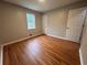 Bedroom featuring wood floors, a window, a closet, and a neutral color palette at 80 Brooks Ln, Dallas, GA 30157