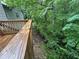 Exterior of wood deck with a view of a lush, green backyard at 80 Brooks Ln, Dallas, GA 30157
