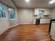 Open-concept kitchen with stainless steel appliances and hardwood floors at 80 Brooks Ln, Dallas, GA 30157