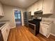 Kitchen featuring stainless steel appliances and stone countertops at 80 Brooks Ln, Dallas, GA 30157