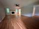 Spacious living room with hardwood floors and a stone fireplace at 80 Brooks Ln, Dallas, GA 30157