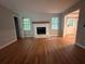 Comfortable living room featuring hardwood floors, fireplace and natural light at 80 Brooks Ln, Dallas, GA 30157