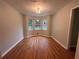 Empty living room featuring hardwood floors, neutral walls and a light fixture at 80 Brooks Ln, Dallas, GA 30157