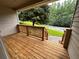 Inviting covered porch featuring wood flooring and a view of the front yard at 80 Brooks Ln, Dallas, GA 30157
